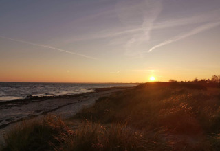 Atardecer visto desde la casa de vacaciones para 6 personas en Idestrup, Dinamarca, junto a la playa.