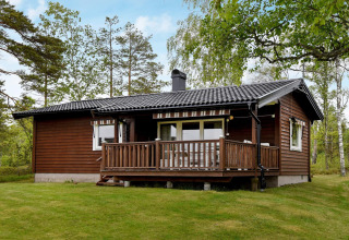 Accogliente casa vacanze per 4 persone a Frändefors, Svezia, immersa nel verde della natura.