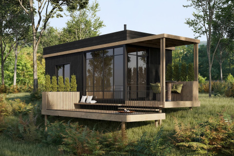 Moderne houten cabin bij Hillview Resort Grandvoir 1 in België, omgeven door weelderige natuur.