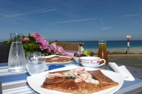 Outdoor lunch overlooking the sea at the nature house Ancient windmill Gommenec'h in France.