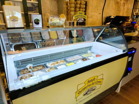 Gelato display counter with assorted flavors at Antica Gelateria del Corso in Trasimeno Glamping Resort, Umbria.