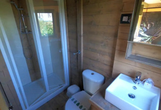 Bathroom inside the 'Air Dreamer' safari tent at Vacanze Glamping Boutique, Italy, featuring a shower.