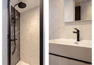 Baño moderno con ducha y grifería negra, Lodge Royal Eco 6 personen, Résidence Lage Vuursche, Países Bajos.