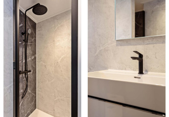Baño moderno con ducha y grifería negra, Lodge Royal Eco 6 personen, Résidence Lage Vuursche, Países Bajos.