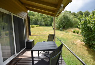 Covered terrace at Holiday home Terra 2 Persons mobile home with garden and nature view in Germany.