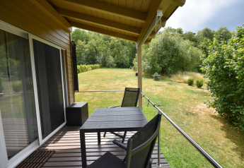 Covered terrace at Holiday home Terra 2 Persons mobile home with garden and nature view in Germany.