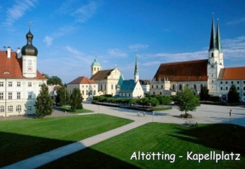 Kapellplatz in Altötting, Germany, featuring churches and historic buildings on a sunny day with blue sky.