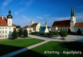 Scenic view of Kapellplatz in Altötting, Germany, featuring historic churches and a spacious square.