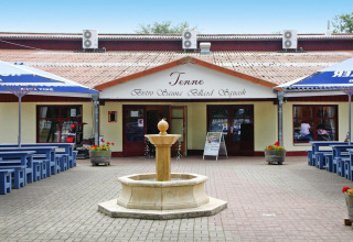Photo of Holiday park Markgrafenheide Warnemünde Type 1 with courtyard fountain and outdoor seating in Germany.