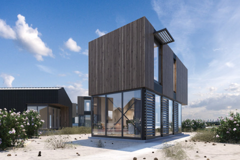 Modern strandhuis bij Sea Lodges Zandvoort 4 met houten gevel en grote raampartijen aan de kust.