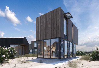 Modernes Strandhaus Sea Lodges Zandvoort 4 mit Holzverkleidung und groĂźen Glasfenstern am Meer.
