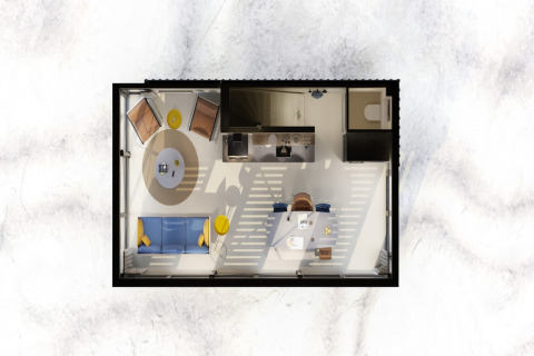 Vista superior de interior de casa moderna en la playa Sea Lodges Zandvoort con cocina y salón.