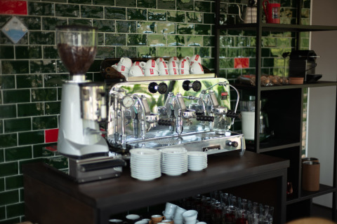 Espresso machine and coffee cups on counter at Sea Lodges Zandvoort 11 beach house in the Netherlands.