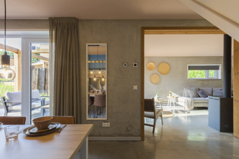 Stylish living and dining area inside a beach house at Noordzee Resort Vlissingen 3 in the Netherlands.