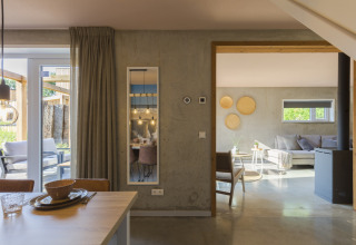 Stylish living and dining area inside a beach house at Noordzee Resort Vlissingen 3 in the Netherlands.