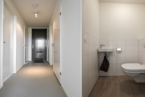 Lys gang og moderne badeværelse på lodge Heerlijkheid Vlietenburg 1 i Holland, med minimalistisk design.