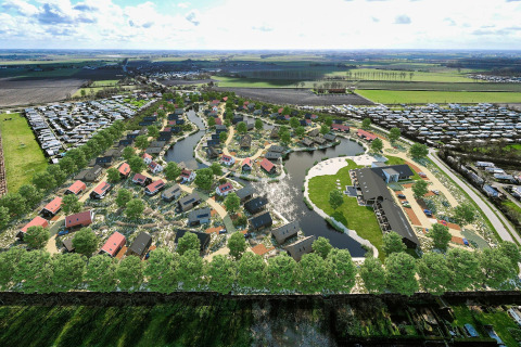 Vista aerea del Resort Nieuwvliet-Bad 13 nei Paesi Bassi, con casette, laghi e campi aperti intorno.