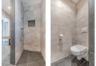 Baño moderno con ducha y sanitario suspendido en el chalet Park de Kievit 19 en Bélgica.