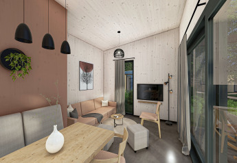 Moderne woonkamer in Holiday Park «Klein Vink 25» in Nederland met grote ramen en houten accenten.