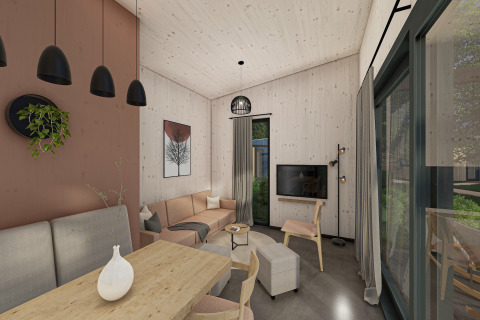 Moderne stue i Holiday Park «Klein Vink 25» i Holland med træmøbler og store vinduer til haven.