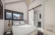 Chambre moderne au Holiday Park «Klein Vink 24» aux Pays-Bas avec lit double et salle de bain attenante.