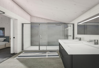 Salle de bain moderne avec double vasque, grande douche et accès à la chambre à Klein Vink 24, Pays-Bas.