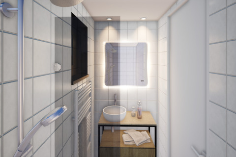 Salle de bain moderne du Resort Gulpen 8 aux Pays-Bas, avec lavabo, miroir éclairé et serviettes.