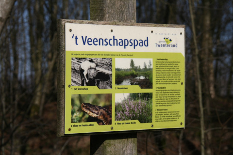 Information board for 't Veenschapspad in Twenterand, Netherlands, showing images and nature descriptions.