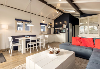 Bright, modern chalet interior at Water park «Terkaple 2» in the Netherlands featuring a cozy living space.