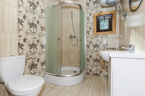 Modern bathroom with shower, toilet, sink, and small window at Holiday complex Pobierowo-Doppelhaus 4 and 2.