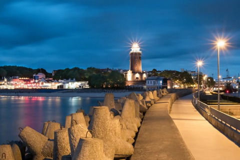 Evening view of Kołobrzeg lighthouse and harbor lights in Denmark, seen from Holiday home for 6 people Kołobrzeg.
