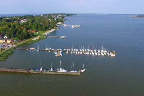 View of a marina with sailboats and calm waters near Summer Cottage 70 m2 TYPE B Osieki, Denmark.