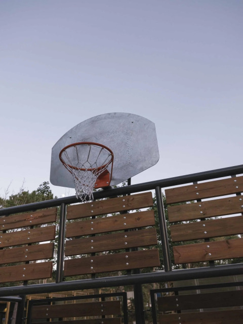Basketball hoop and wooden panels at Wecamp Santa Cristina holiday park in Catalonia, Spain.