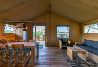 Interior of a luxury safari tent at Villa Holiday Park IJsselhof 12, Netherlands, with modern furnishings.
