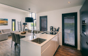 Modern kitchen and living area at Holiday Park Zeedijk 2, Netherlands, featuring bright, stylish interiors.