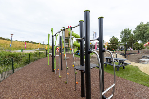 Playground with climbing frames and slides at Beach Park Vlugtenburg 13, Netherlands, outdoor setting.
