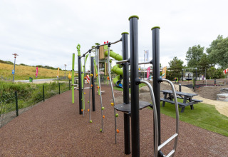 Playground with climbing frames and slides at Beach Park Vlugtenburg 13, Netherlands, outdoor setting.