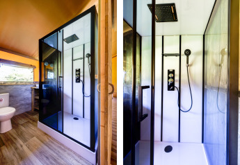 Modern bathroom and shower inside a safari tent at Country Estate “Gerner 8” in the Netherlands.