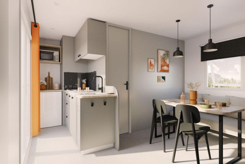 Moderne Next L Titania lodge met keukenblok, eettafel, groot raam en hedendaags interieur.