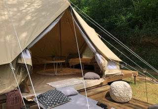 The Emperor Bell Tent safari tent at Campsite Moulin de Chaules in France, showing deck and cozy interior.