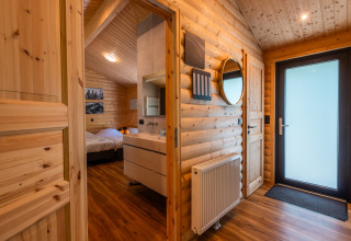 Interior view of Wellness Lodge «Wood XL» at Holiday park De Wiltzangh, featuring cozy wood décor.
