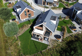 Aerial view of modern holiday homes and gardens at EuroParcs Texel holiday park, North Holland, Netherlands.