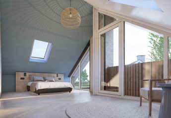 Camera moderna in Duinvilla Wellness con soffitto inclinato, grandi finestre e luce naturale abbondante.