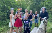 Kids and adults in costumes enjoying festivities at Campsite San Lanaco, Belgian Limburg, in the woods.