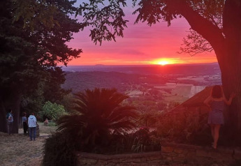 Beautiful sunset view from a safari tent with private bathroom at Agricampeggio La Prugnola, Italy.