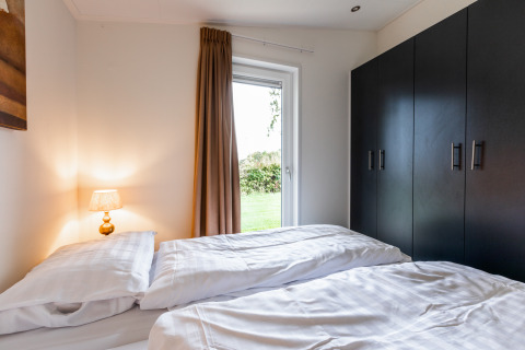 Gezellige slaapkamer in Schaelsbergerbosch - Garden House & bij Resort Mooi Bemelen, Nederland, hedendaags ingericht.