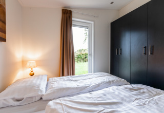 Gezellige slaapkamer in Schaelsbergerbosch - Garden House & bij Resort Mooi Bemelen, Nederland, hedendaags ingericht.