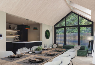Modernes, helles Lodge-Interieur mit großem Fenster, Esstisch und Küche im Eco Boslodge Jacuzzi in den Niederlanden.