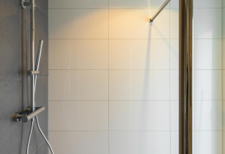 Modern shower with rainfall head at Ecovilla Waterzicht Comfort, Holiday park Latour, Netherlands.