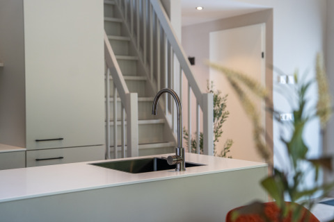 Modern kitchen sink and faucet in Ecovilla Waterzicht Luxe at Holiday park Latour, Netherlands.